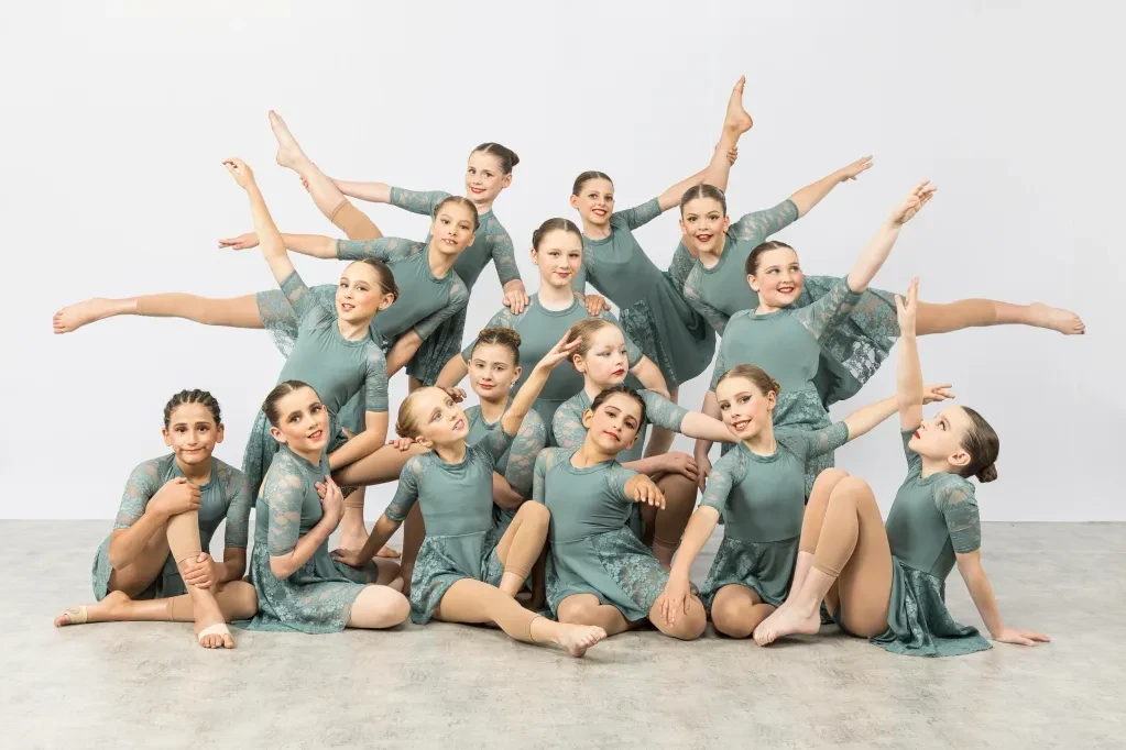 Young dancers posing in synchronised group formation