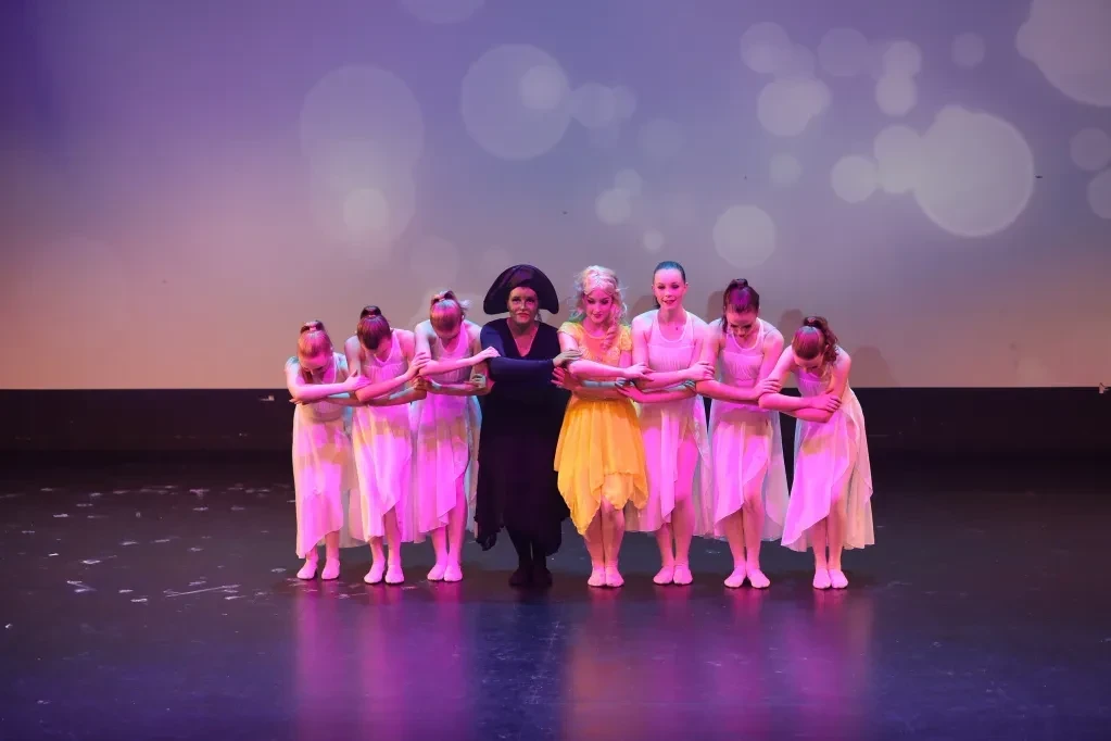 Young dancers performing on stage together